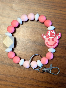 Pink smiley Face wristlet