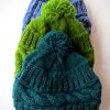 Knit Hat With Cable Design and Pom Pom
